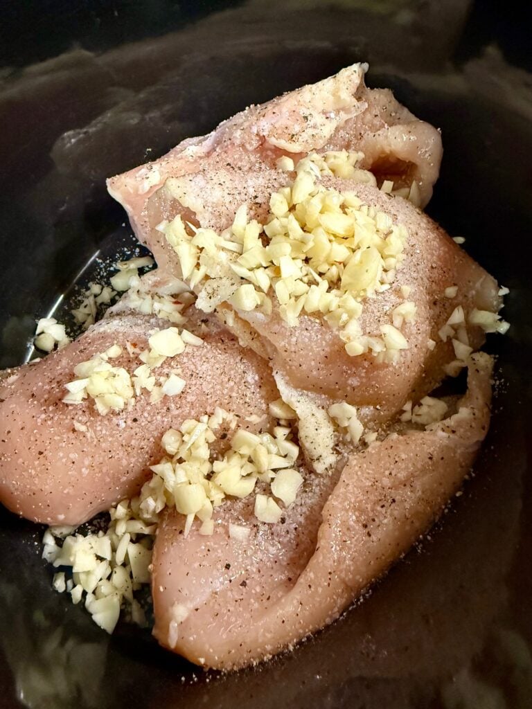 chicken in the slow cooker before cooking