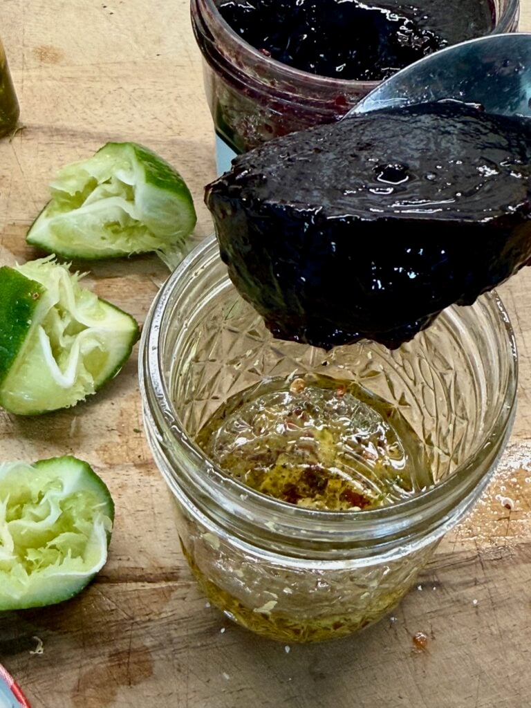 making the blackberry lime salad dressing