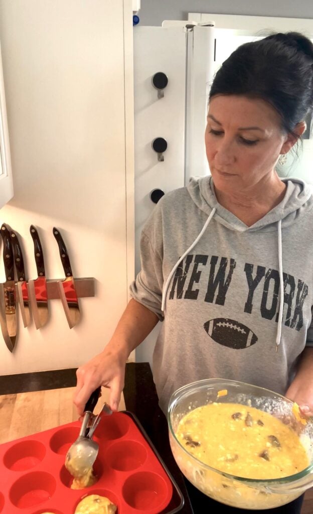 scooping batter for Meal Prep Steak and Egg Bites