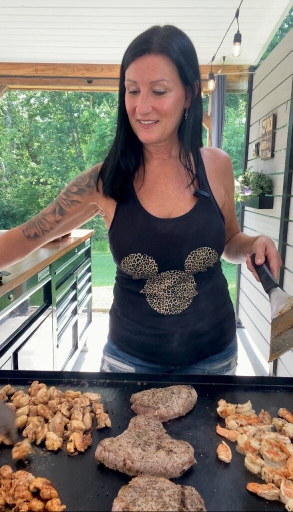 cooking steak and shrimp on the griddle