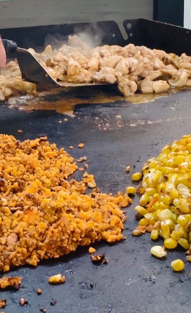 cooking corn and sweet potato rice on the griddle