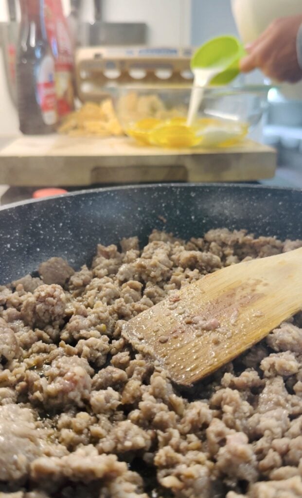 cooking sausage in a skillet
