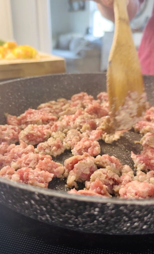 cooking sausage in a skillet